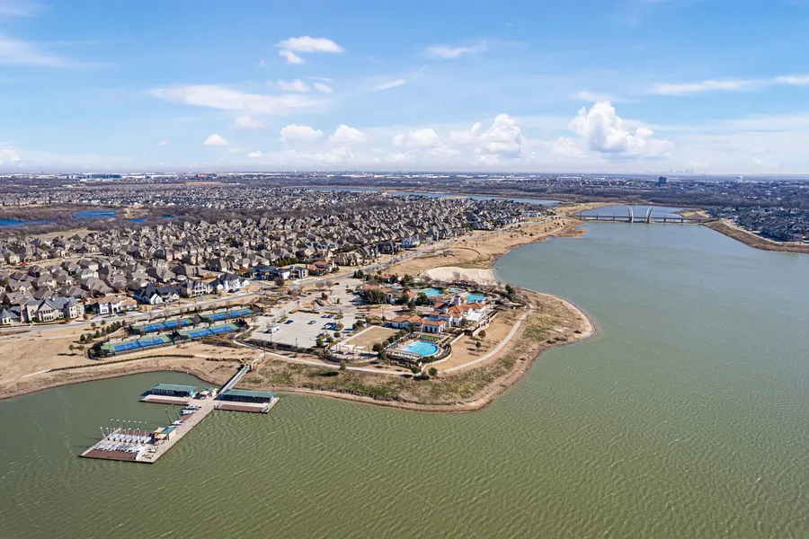 Aerial view of Viridian's lake, marina, resort pools, and tennis courts