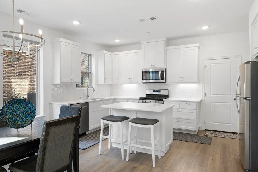 Kitchen with white cabinets and granite counters at 4335 Fall Blossom Dr