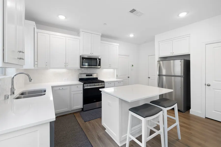 Kitchen with stainless appliances and a center island at 4335 Fall Blossom Dr
