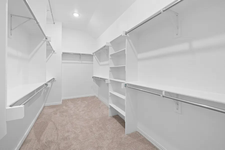 Walk-in closet with built-in shelving at 4335 Fall Blossom Dr
