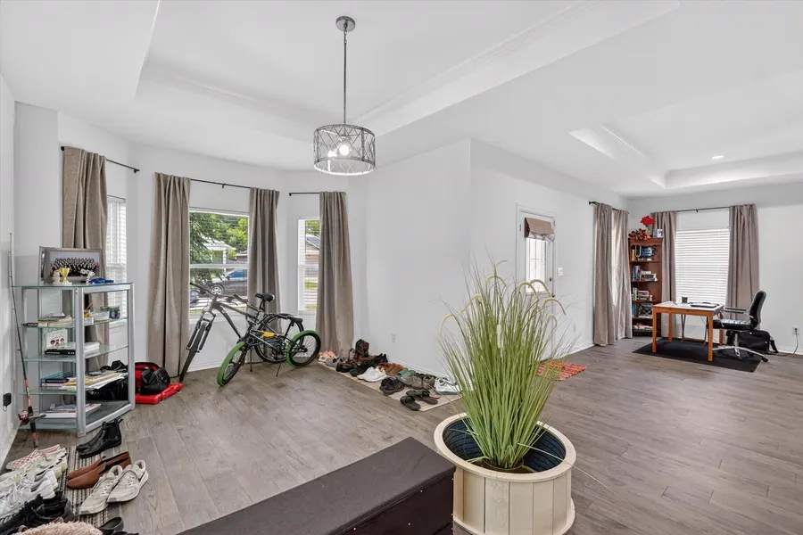 Bonus room and hallway view toward the kitchen at 4552 Corregidor St
