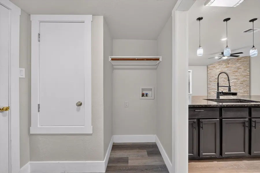 Laundry area with washer hookups and a utility closet off the kitchen at 716 River Hill Ln